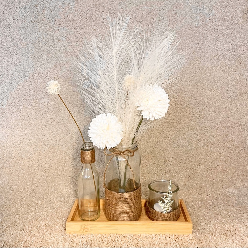 Decorative rustic tray glass jars and flowers and pampas